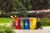 assorted color plastic trash bins