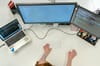 female software engineer coding on computer