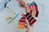 person holding color palettes