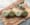 four green yarns on chopping board