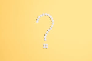 pills fixed as question mark sign