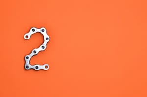 gray steel chain on orange surface