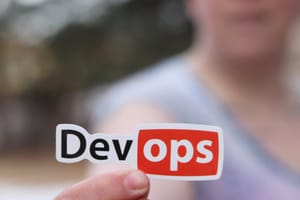 person holding a sticker