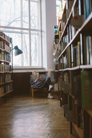 woman reading in library