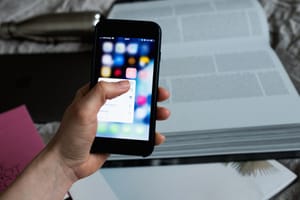 crop unrecognizable person choosing application on smartphone