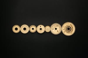 photo of golden cogwheel on black background